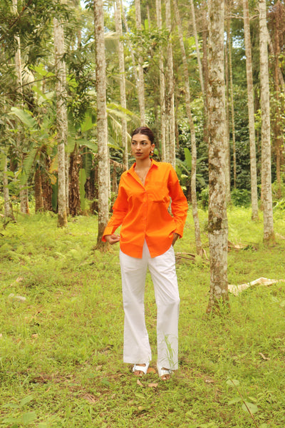 Orange shirt with white pants