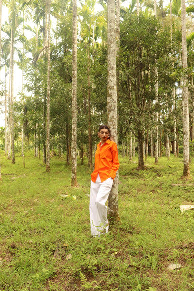 Orange shirt with white pants